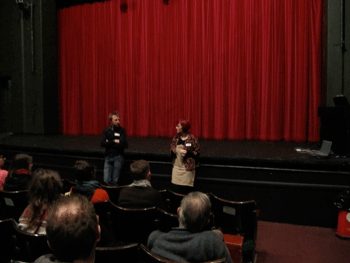 michael and becci infront of theatre curtain