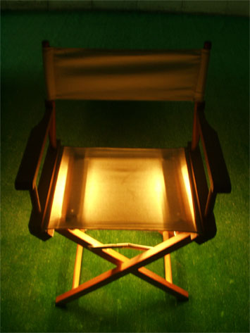Cream directors chair- seat glowing - for audience to sit in