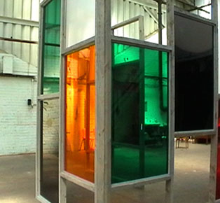 Manica Karlson's instalation - oragnge and green perspex in wooden frame, with speaker on back wall